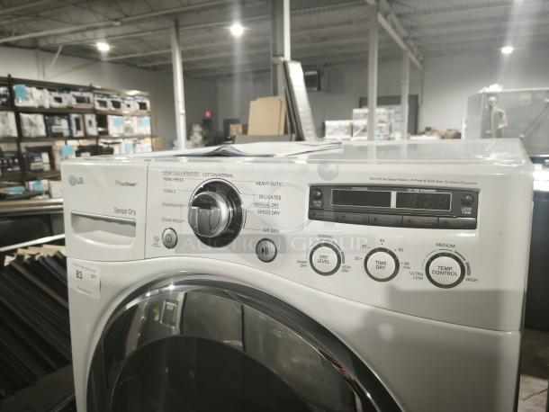 LG DLEX2650W 27" white electric dryer, 7.3 cu. ft. capacity, 9 cycles, steam, sensor dry, LED display, excellent condition.