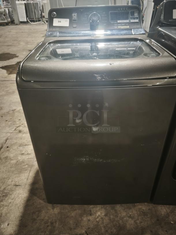 GE® 5.0 cu. ft. washer, model GTWS8655D0MC, stainless steel basket, with steam. Excellent condition, control panel visible.