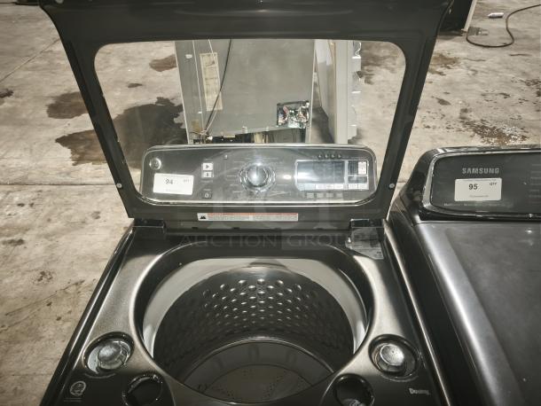 GE® 5.0 cu. ft. washer GTWS8655D0MC with stainless steel basket, steam feature, and digital controls in good condition.