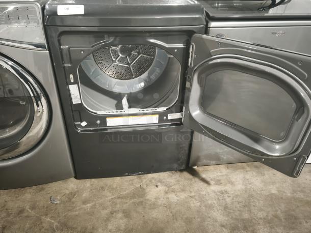 GE Profile 7.4 Cu. Ft. Smart Electric Dryer, model PTD60EBPRDG, in Diamond Gray with open door showing interior.