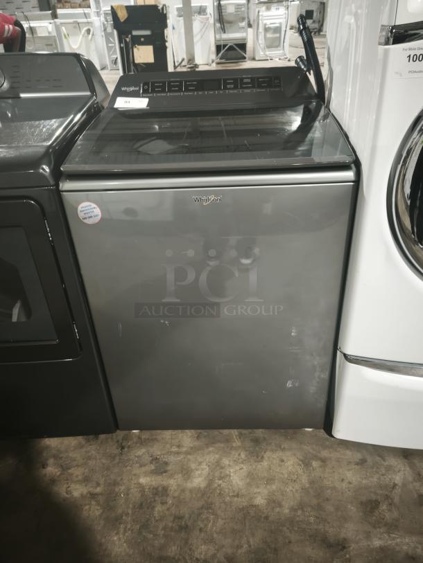 Whirlpool 4.7 Cu. Ft. Top Load Washer, model WTW5105HC2 in Chrome Shadow, features Pretreat Station. Slight wear visible.