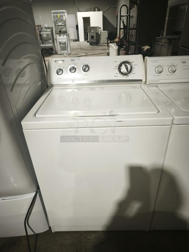 Whirlpool WTW5200VQ0 top-load washer, white, multiple control dials, well-maintained, visible Whirlpool branding, clean condition.