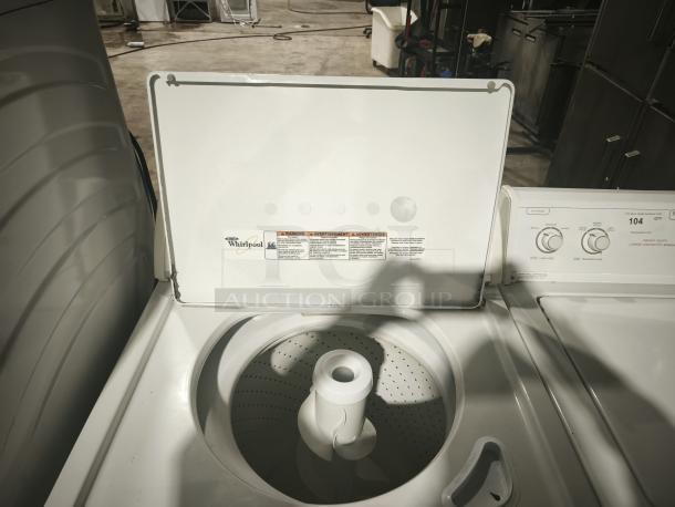 Whirlpool WTW5200VQ0 top-load washer with open lid, visible control knobs, and interior drum. Appears in good condition.