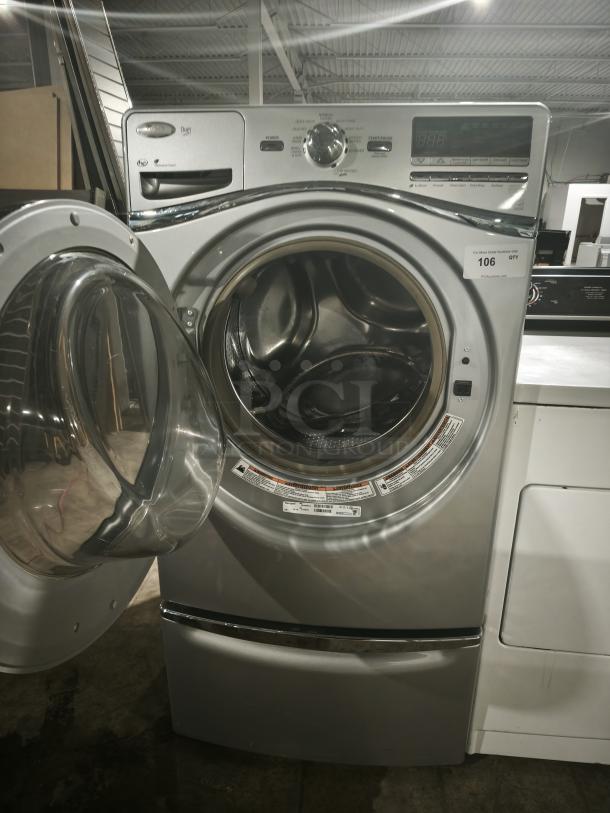 Whirlpool WFW94HEXL2 front-load washer, silver, open door, digital display, multiple cycle options, excellent condition.