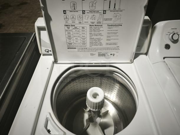 Speed Queen AWN412SP111TW01 top-load washer, open lid, visible drum and control panel instructions, white finish, excellent condition.