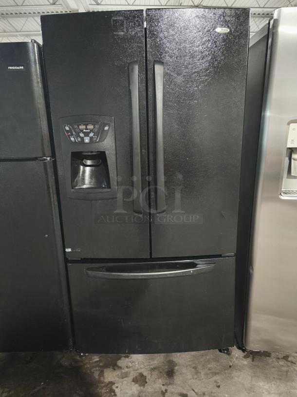 AMANA 25.0 cu. ft. black French door refrigerator, model afi2538aeb, with external ice/water dispenser, in used condition.