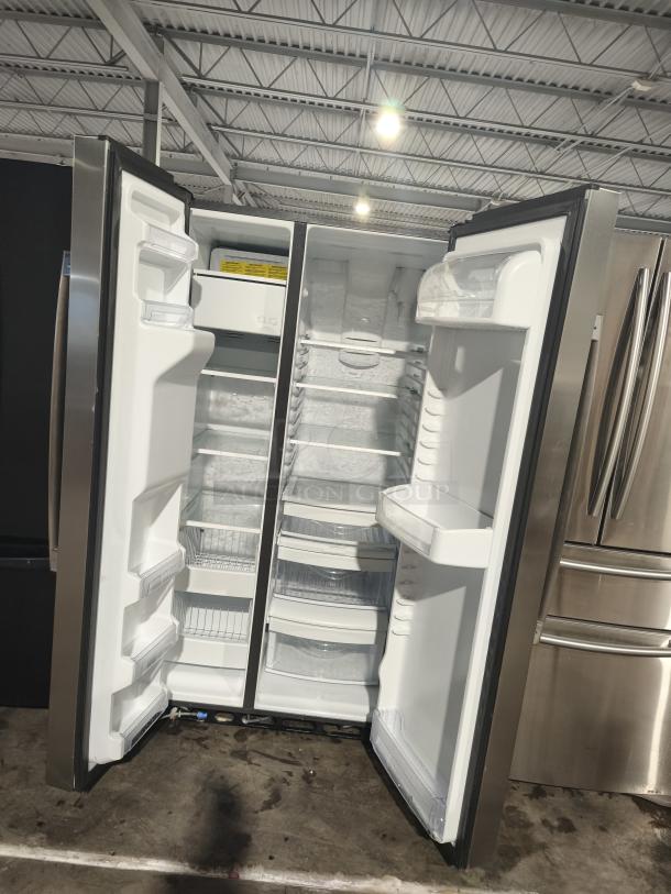 GE 25.3 cu. ft. Side by Side Refrigerator, Model GSS25IYNRHFS, in Fingerprint Resistant Stainless Steel, open doors.