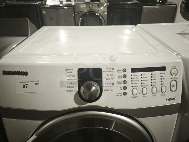 Samsung DV407AEW/XAA 7.3 Cu. Ft. front load electric dryer. Features multiple drying modes, cycle options. Appears in good condition with visible control panel details.
