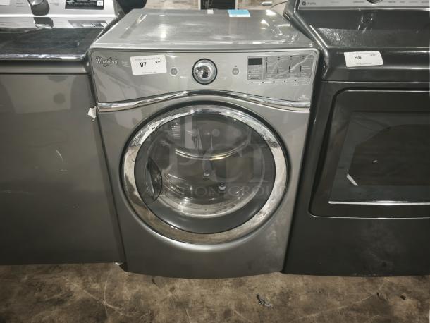 Whirlpool Duet WGD96HEAC gas steam dryer, 7.4 cu. ft., stainless finish, good condition, auction tag visible.