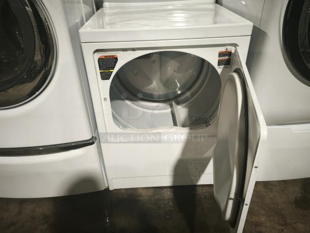 Maytag MDE3757AYW electric dryer, white, front load, open door, visible caution labels, used condition, auction item.