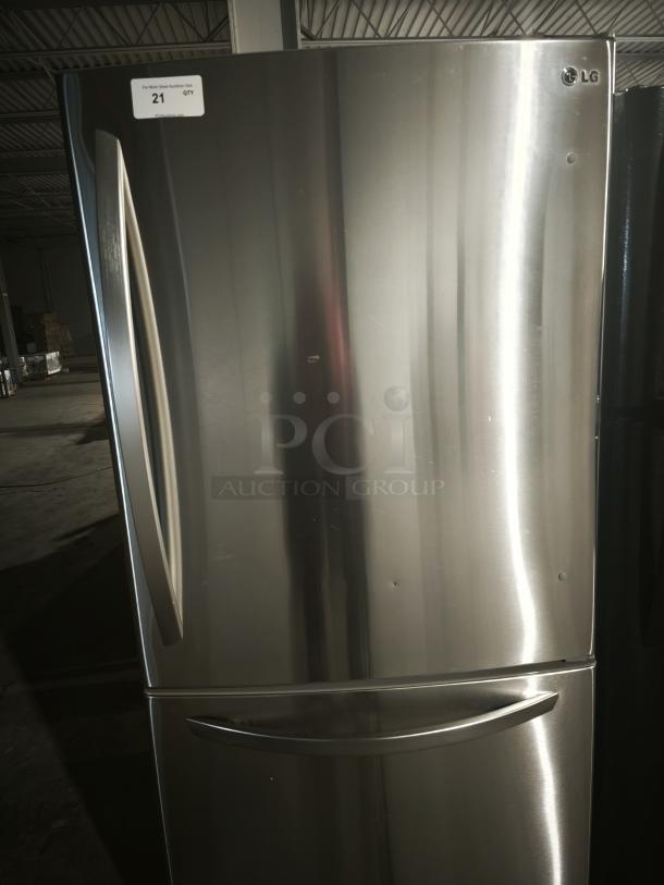 LG 22.4 cu ft single door refrigerator with pull-out bottom freezer. Stainless steel finish, excellent condition. Model visible.