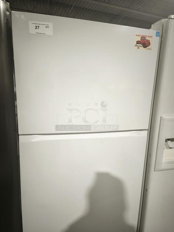 Criterion® fridge refrigerator, model 453-8090, top-freezer white finish, features a minor dent. Includes auction label and vintage sticker.
