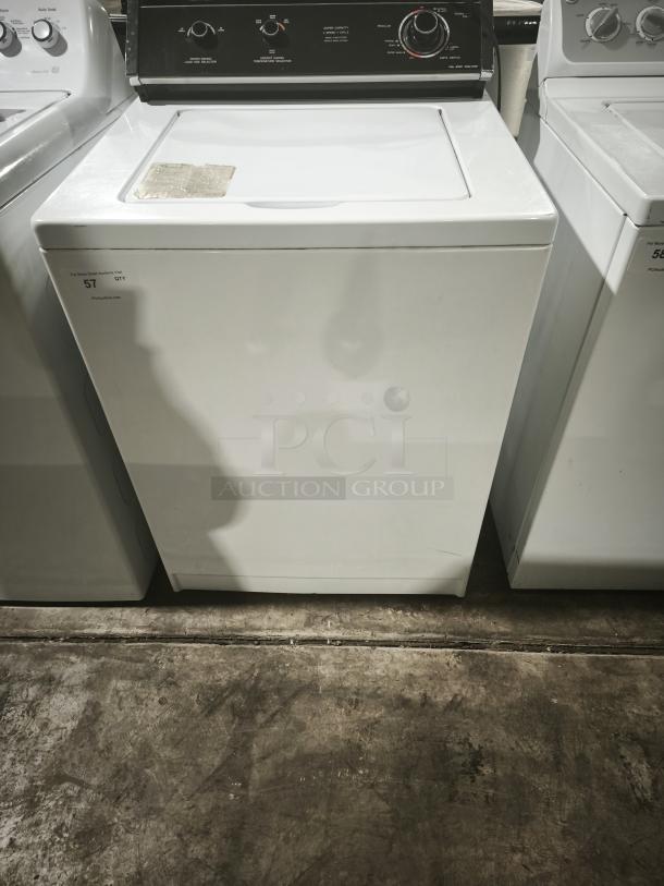 Whirlpool LA5580XTW1 washer, white, front view. Features dial controls. Moderate wear. Model and settings visible.