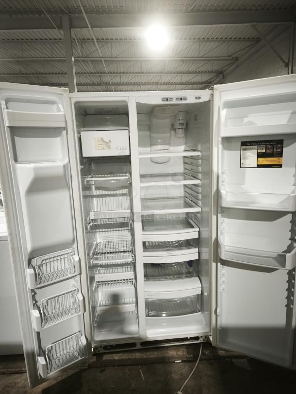 GE Eterna-series refrigerator, model ESS25LGMB, with open doors showing shelves and drawers in clean condition.