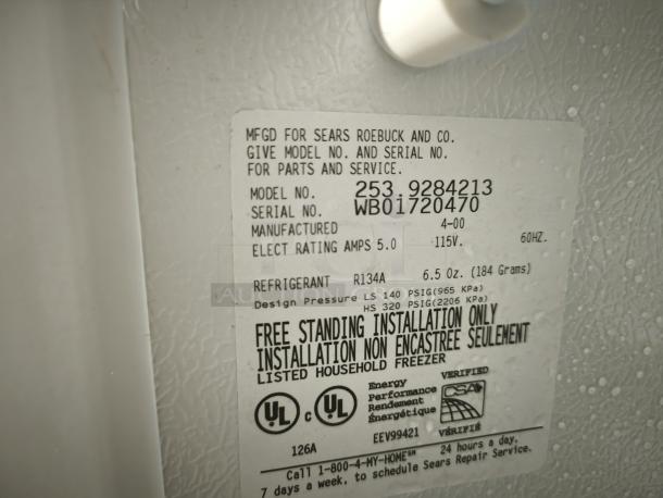 Kenmore 2539284213 Upright Freezer label; model and serial numbers visible, 115V, R134A refrigerant. Freestanding use.