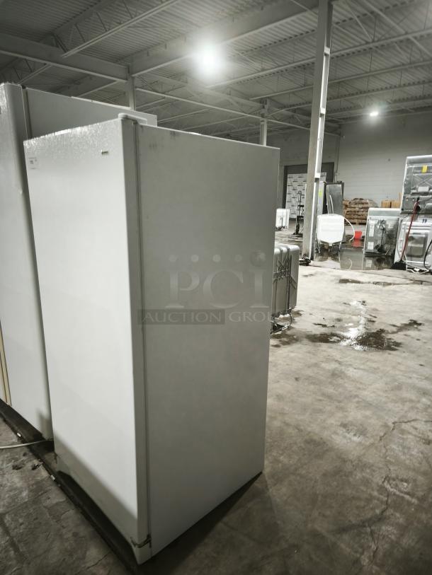 Kenmore 253.9284213 Upright Freezer in white, good condition, minimal wear, warehouse setting.