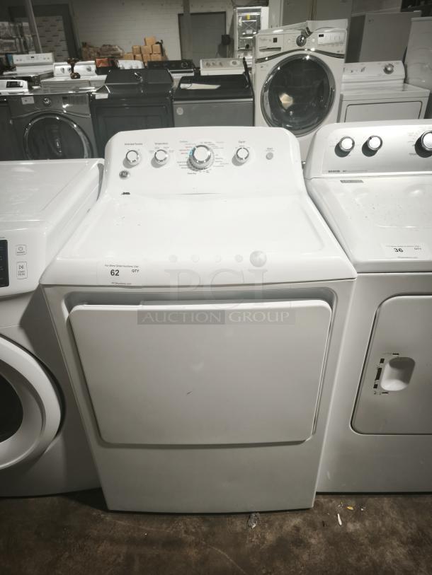 GE 7.2 cu. ft. Electric Dryer, Model GTD42EASJWW, white, in used condition. Features control knobs and a front-loading door.