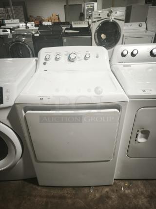 GE 7.2 cu. ft. Electric Dryer, Model GTD42EASJWW, white, in used condition. Features control knobs and a front-loading door.