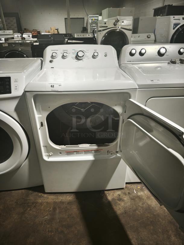 GE 7.2 cu. ft. Electric Dryer, Model GTD42EASJ2WW, white, open door, control knobs, good condition, auction label visible.