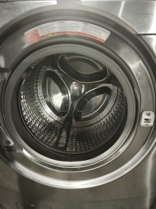 Samsung 27-inch front-load steam washer, model WF448AAP/XXA. Visible drum interior, stainless steel finish, high-efficiency.