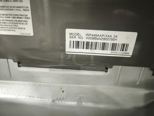 Samsung 27-inch front-load steam washer, model WF448AAP/XXA, serial W03954AZB00785H, made in Korea, visible label.