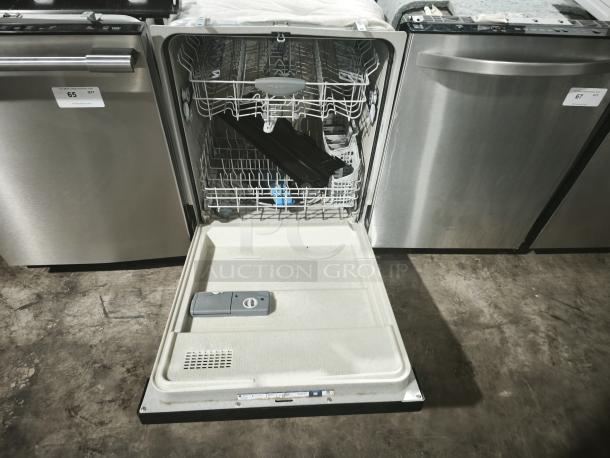 Frigidaire Gallery FGBD2445NF dishwasher, open door, stainless steel finish, visible interior racks, gently used condition.