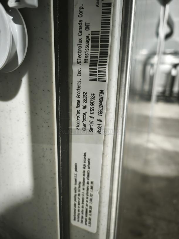 Frigidaire Gallery FGBD2445NF dishwasher, model and serial number label visible, showing Electrolux manufacturing details.