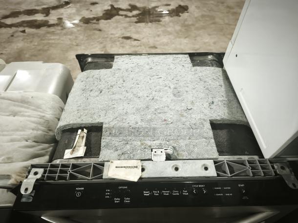 Kenmore Elite 63013913010 dishwasher, black control panel, visible insulation, minor wear, labels with model details.