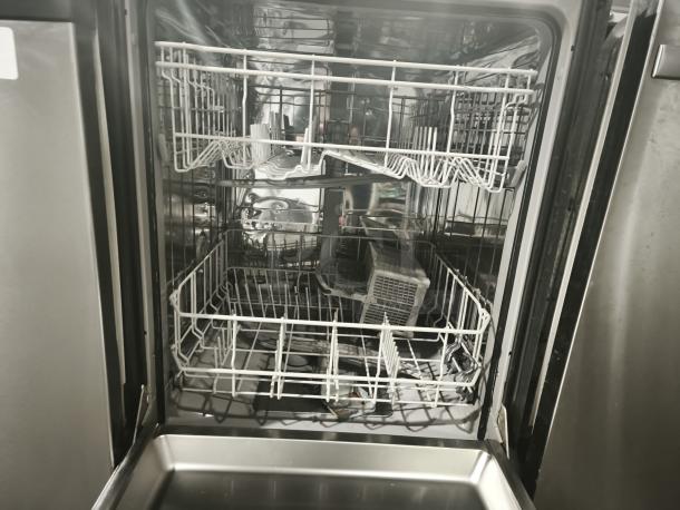 Kenmore Elite 63013913010 dishwasher open; features adjustable racks, stainless interior, good condition.