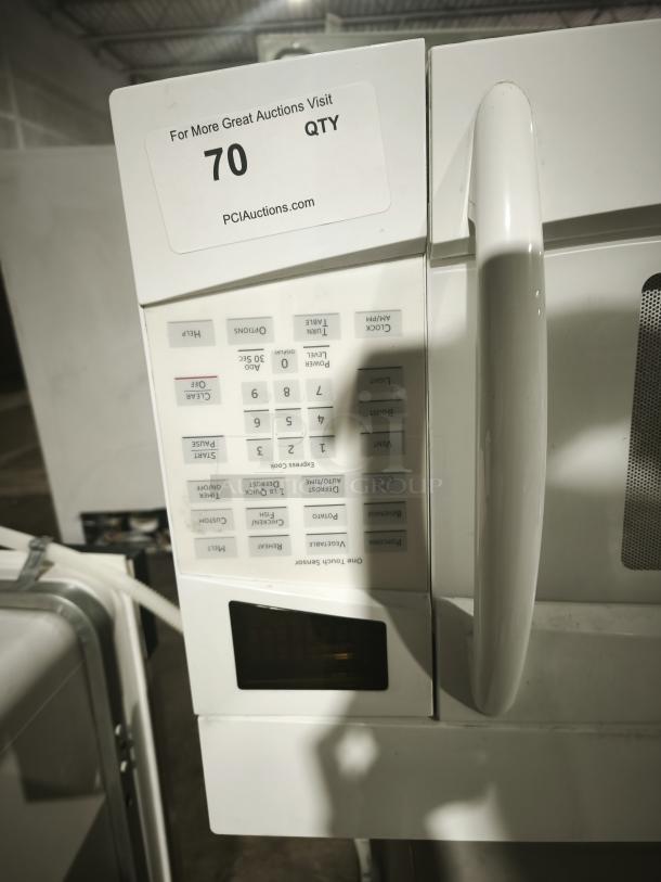 GE Profile Spacemaker 1.8 Cu. Ft. XL1800 Microwave, Model PVM1870DM3WW, white, keypad and handle shown, good condition.