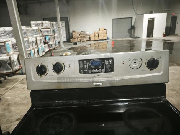 Whirlpool 30" electric range, model RF362LXSS, with self-cleaning feature. Visible wear on control panel. Freestanding design.