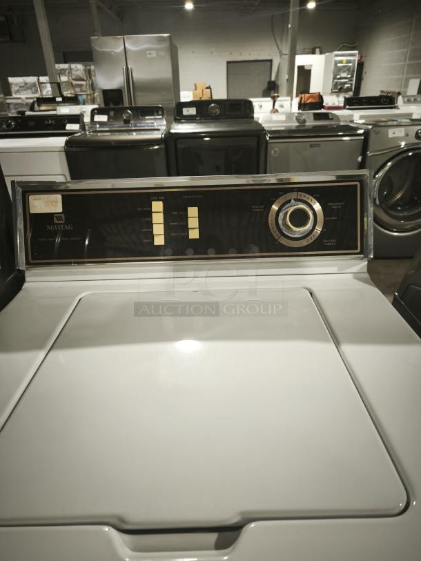 Maytag A511 top-load washer, vintage model, white, visible control panel with dial and buttons, well-maintained condition.