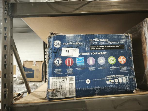 GE® 6,200 BTU Ultra Quiet Window Air Conditioner, Model AHD06LZ, for rooms up to 250 sq. ft. Box is worn with visible labels.