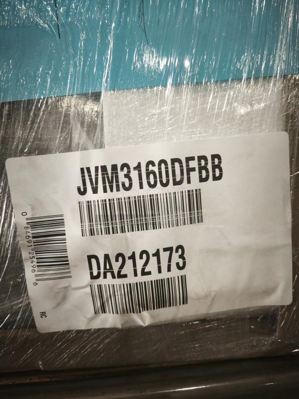Label on GE Microwave Oven Model JVM3160DFBB with barcode and code DA212173, wrapped in protective plastic.