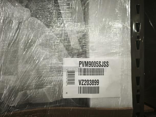 GE Profile™ 2.1 Cu. Ft. Over-the-Range Sensor Microwave Oven, Model PVM9005SJSS, wrapped for protection with visible model label.