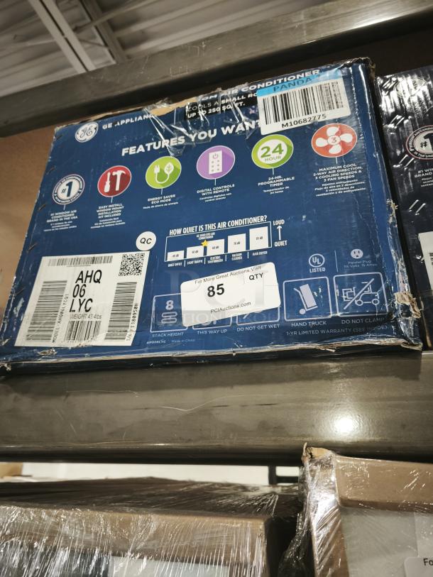 GE 6,000 BTU Window Air Conditioner, Model AHQ06LYC. New in box, suitable for rooms up to 250 sq ft. Features energy-saving mode and remote control.