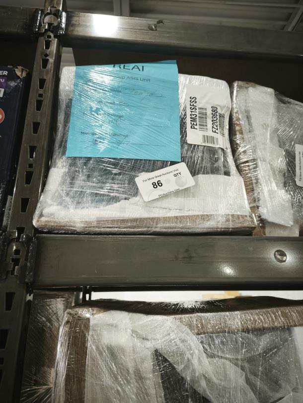 GE Profile 1.1 Cu. Ft. Countertop Microwave Oven, stainless steel, model PEM31SFSS, wrapped on pallet with labels shown.