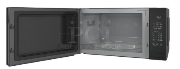 GE Profile 2.2 cu. ft. built-in sensor microwave oven, model PCWK22U1WDD, gray finish, open door, digital display.