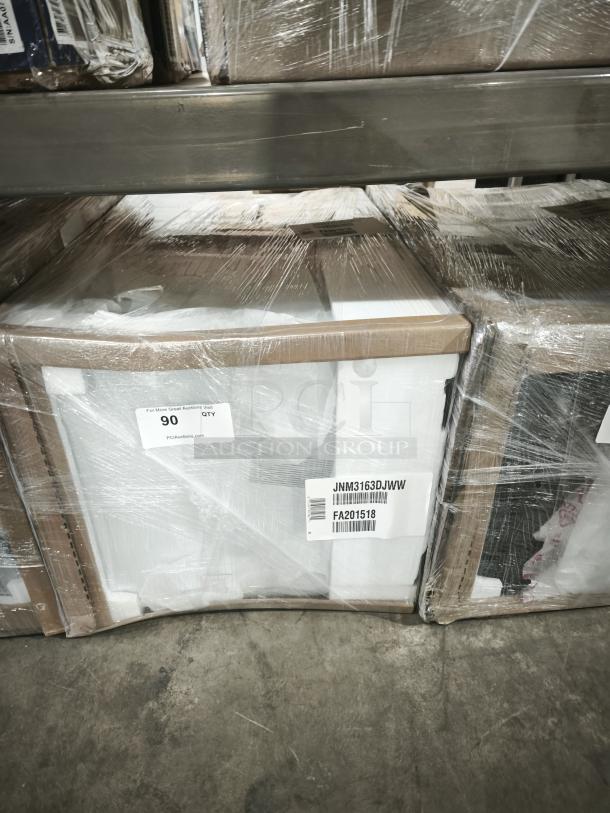 GE 1.6 Cu. Ft. Over-the-Range Microwave Oven, model JNM3163DJWW, wrapped and labeled on a pallet. New condition.