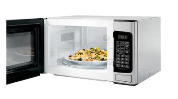 GE 1.1 cu. ft. countertop microwave oven in stainless steel, model GCST11N1WSS, with digital control panel and open door.