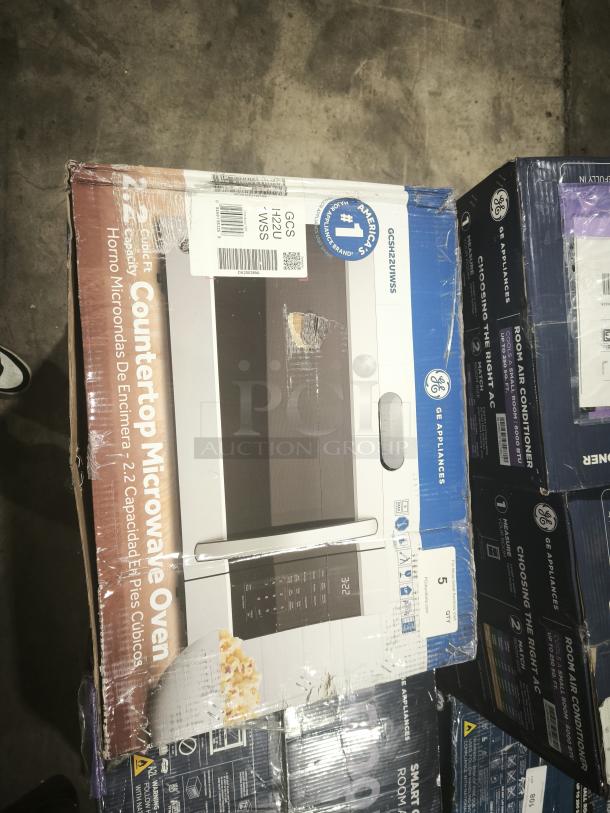 GE® 2.2 Cu. Ft. Countertop Microwave Oven, Model GCSH22UWSS, new in original packaging with labels visible.