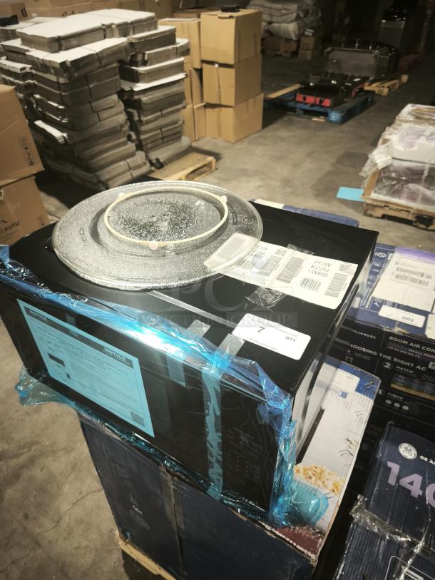 GE Profile™ 2.2 Cu. Ft. Built-In Sensor Microwave Oven, Model PCWK22U1WBB, in original packaging with visible labels.
