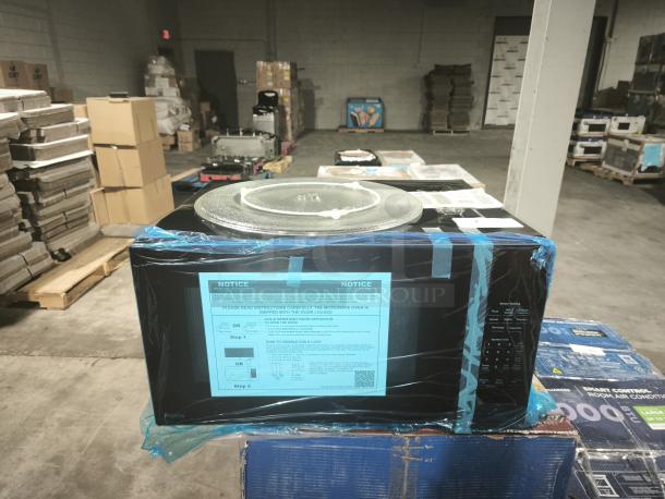 GE Profile™ 2.2 Cu. Ft. Built-In Sensor Microwave Oven (Model PCWK22U1WBB), new condition, protective plastic wrap.
