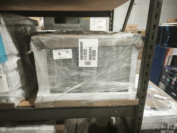 GE 8,000 BTU Smart Heat/Cool Air Conditioner, Model AWGH08WWF, wrapped for auction. Visible model label and auction ID tag.