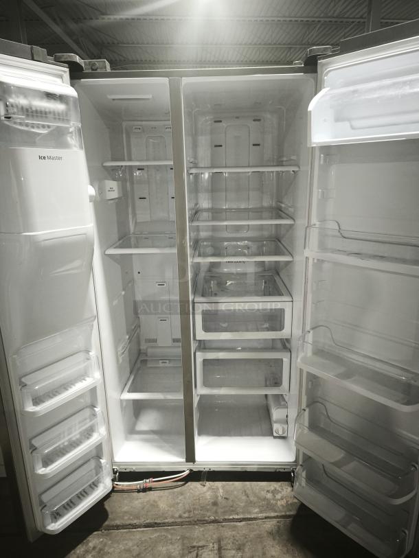 Samsung 24.5 Cu. Ft. Side-by-Side Refrigerator, Model RS25H5111SR, with In-Door Ice Maker, spacious interior, clean condition.