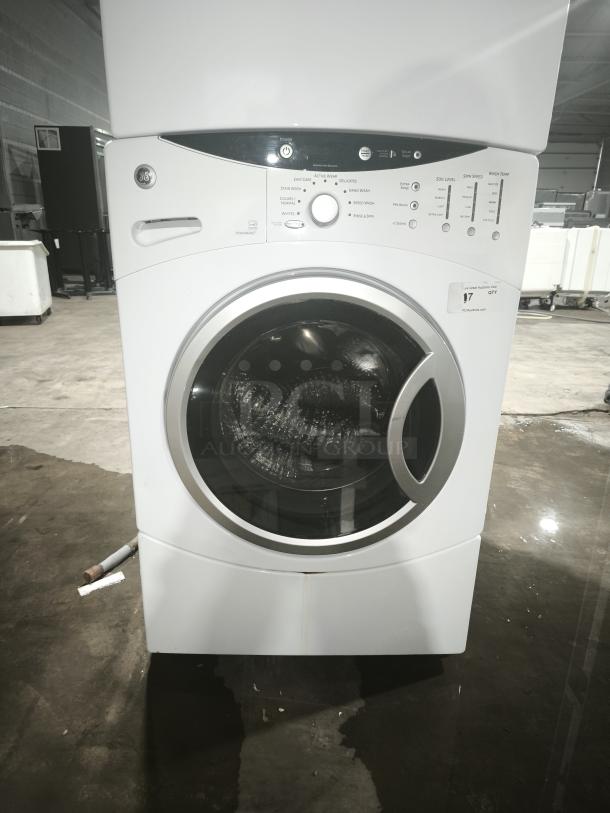 GE® 3.7 Cu. Ft. Frontload Washer, Model WCVH6260HWW, features stainless steel drum, visible control panel, good condition.