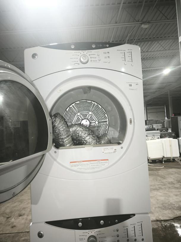 GE® 7.0 Cu. Ft. Super Capacity Electric Dryer, model DCVH515EF0WW, featuring multiple settings, open door, with vent hose inside.