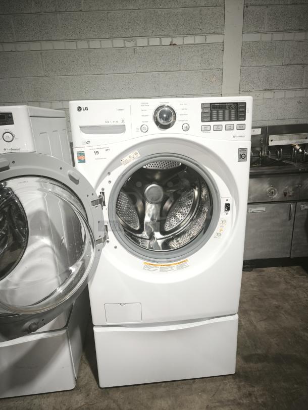LG 4.3 cu. ft. Ultra-Large Capacity Steam Front-Load Washer, Model WM3370HWA, open door, good condition, white.