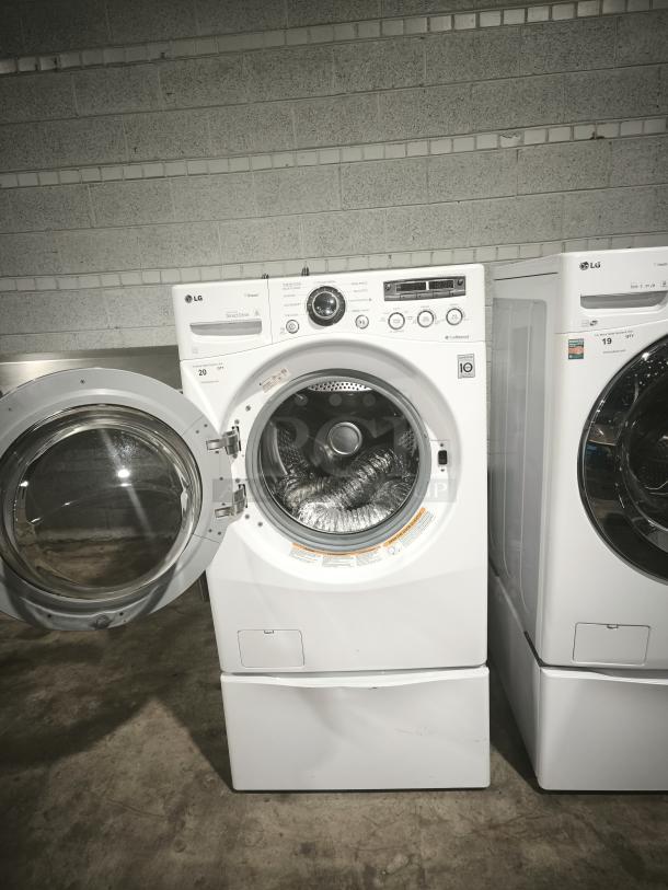 LG Steam Washer 3.6 cu. ft. Front-Load, Model WM2650HWA, white, extra-large capacity, open door, visibly good condition.