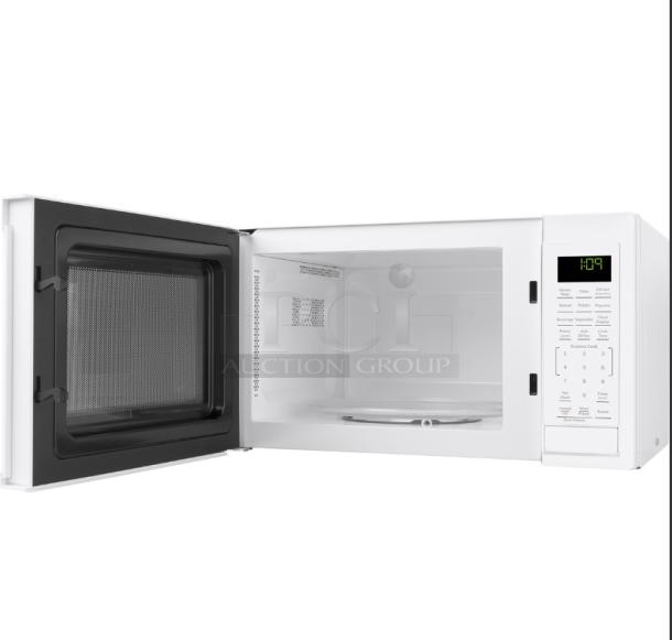 GE® 0.9 Cu. Ft. white countertop microwave oven, model GCST09N1WWW, open with control panel visible.